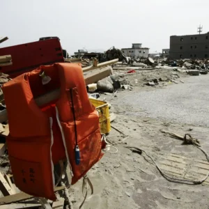 A View of debris and mud covered at Tsunami hit Destroyed city in Rikuzentakata on March 20, 2011, Japan. On 11 March 2011, an earthquake hit Japan with a magnitude of 9.0, the biggest in the nation's recorded history and one of the five most powerful recorded ever around the world. Within an hour of the earthquake, towns which lined the shore were flattened by a massive tsunami, caused by the energy released by the earthquake. With waves of up to four or five metres high, they crashed through civilians homes, towns and fields.