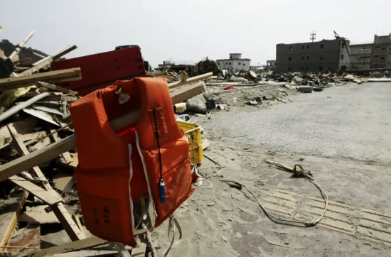 A View of debris and mud covered at Tsunami hit Destroyed city in Rikuzentakata on March 20, 2011, Japan. On 11 March 2011, an earthquake hit Japan with a magnitude of 9.0, the biggest in the nation's recorded history and one of the five most powerful recorded ever around the world. Within an hour of the earthquake, towns which lined the shore were flattened by a massive tsunami, caused by the energy released by the earthquake. With waves of up to four or five metres high, they crashed through civilians homes, towns and fields.