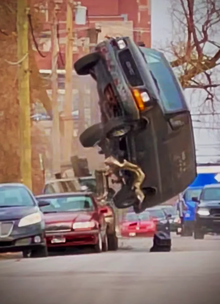 Image of a van, driven by stuntman, Aaron Crippen, out of control and flipping through the air.